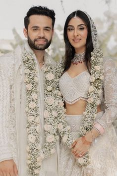 the newly married couple is posing for a photo