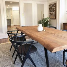 a large wooden table with chairs around it