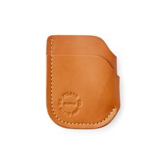 a tan leather case with stitching on it