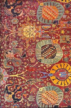 an old rug with many different designs on it