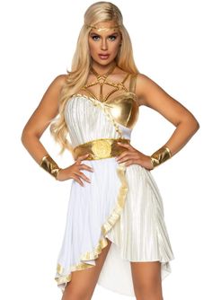 a woman in a white and gold costume with her hands on her hips, posing for the camera