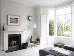 a living room with a fire place and television