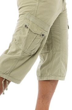 Style an on-trend look in cargo shorts crafted from breathable cotton for comfort during casual outings. 18" inseam; 10" front rise (size 32) Zip fly with button closure 100% cotton Machine wash, tumble dry
 Imported Model stats: 6'1" height, 32" waist. Model is wearing size 32. Utility Cargo Shorts With Pockets, Knee-length, Knee-length Utility Cargo Pants With Multiple Pockets, Knee-length Utility Cargo Shorts With Pockets, Knee-length Utility Cargo Pants With Side Pockets, Knee-length Utility Cargo Bottoms, Knee-length Utility Bottoms With Cargo Pockets, Knee-length Utility Cargo Pants, Khaki Bermuda Shorts With Pockets, Khaki Knee-length Bermuda Shorts With Pockets