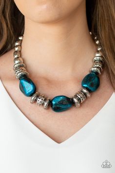 A collection of classic silver beads, ornate silver accents, and metallic blue faux rock beads are threaded along an invisible wire below the collar for a statement-making finish. Features an adjustable clasp closure. Sold as one individual necklace. Includes one pair of matching earrings. P2ST-BLXX-089XX