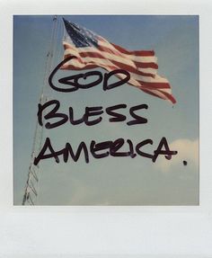 an american flag with the words god, bless america written in black ink on it