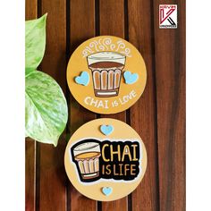 two wooden coasters that say chai is life and one has a glass of beer