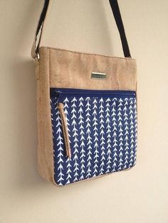 a blue and white bag hanging on the wall