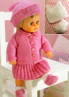 a doll sitting on top of a white chair wearing a pink knitted sweater and hat