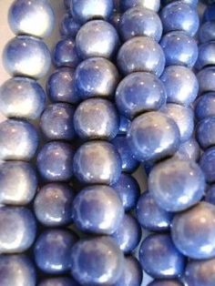 blue pearls are stacked on top of each other