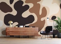 a living room with an animal print wallpaper and wooden furniture in front of it