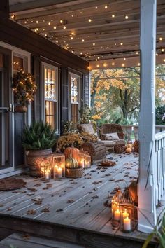 a porch covered in lots of lit candles