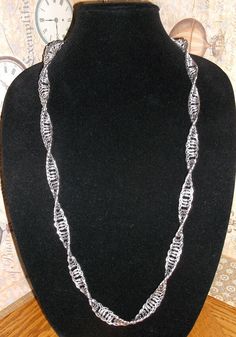 I made this necklace with polished aluminum jump rings, made in the USA.  Due to that it is light weight and has a  toggle clap that is sliver.  The necklace  measures 30 inches long.  Anyone can use this beautiful piece to either make an outfit more elegant or casual, depending on the setting. If you have any question please fell free to contact me. I do ship outside the United States.  Please contact me before purchasing and I will gladly calculate how much the shipping will be.  Thank you. I hope you have as much joy wearing it as I did creating it. Thank you for visiting my shop and I hope to see you again soon. Have a great day, Marie N-02 Cheap Silver Spiral Necklace, Aluminum Bracelets, Make An Outfit, See You Again Soon, See You Again, Box Chain, Jump Rings, Ruby Red, Have A Great Day