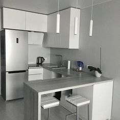 a black and white photo of a kitchen with the number 4, 3 m2