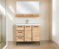 a bathroom with a sink, mirror and wooden cabinet in the middle of the room