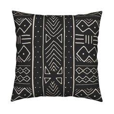 a black and white pillow with geometric designs