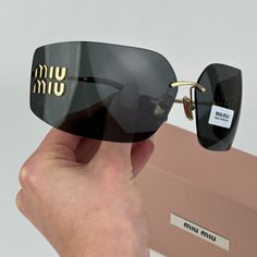 Miu Miu Mu54ys 5ak5s0 Brand New Sunglasses Gold Dark Grey Wraparound Rimless Women Brand: Miu Miu Model: Mu54ys Color Code: 5ak5s0 Gender: Women Year: 2023 Frame Colour: Gold Frame Shape: Wraparound Frame Style: Rimless Frame Material: Metal Lens Color: Dark Grey Lens Material: Polyamide Uv Protection: Category 3 Size: 80x14x110 100% Uv Protection Brand New And 100% Authentic! Made In Italy. Full Retail Miu Miu Set Includes: 1. Glasses 2. Cleaning Cloth With Brand Logo 3. Booklet 4. Case 5. Pouc Pretty Sunglasses, Miu Miu Sunglasses, Rimless Frames, Stylish Glasses, Gold Sunglasses, Wrap Around, Woman Colour, Gold Frame, Miu Miu