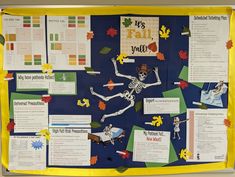 a bulletin board with skeleton and fall leaves on it's side, in front of a blue background