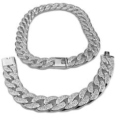 CHAIN Mens cuban link 18" choker chain necklace. Silver tone rhodium plated over alloy metal. Choker chain has weight to it 190 grams. This piece feels substantial - solid design. All links encrusted with round-cut stones. Choker chain is 18 inches long x 18mm wide. Features a big and chunky box clasp lock. Made in Korea for superior workmanship. BRACELET Dazzling men's Cuban link bracelet. Silver tone rhodium plated over alloy metal. Made with a nickel-free alloy metal core. Lustrous cuban link Silver Cuban Link Jewelry For Streetwear, Silver Chunky Cuban Link Jewelry, Silver Chain Link Jewelry For Streetwear, Silver Cuban Link Chain Necklace, Silver Cuban Link Chain Necklace Iced Out, White Gold Chunky Cuban Link Necklace, Silver Iced Out Chain Link Bracelet, Silver Curb Chain Jewelry For Streetwear, Silver Link Jewelry For Streetwear