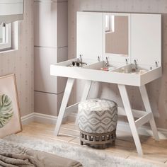 a white vanity with two sinks and mirrors