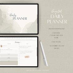 the daily planner is displayed on top of a tablet and next to a notepad