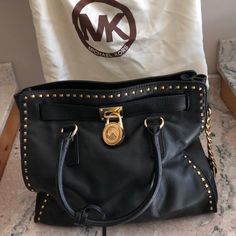 Barely Used Black Shoulder Bag; Great Condition. May Look Creased In Pics But It's In Excellent Condition. Rarely Used. Luxury Michael Kors Shoulder Bag With Logo Hardware, Michael Kors Formal Bag With Logo Hardware, Formal Michael Kors Bag With Logo Hardware, Designer Michael Kors Satchel With Branded Hardware, Designer Michael Kors Satchel With Metal Hardware, Tan Leather Bag, White Backpack, Bags Michael Kors, Michael Kors Crossbody Bag