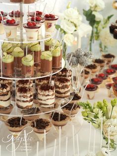 an assortment of desserts are displayed on a table