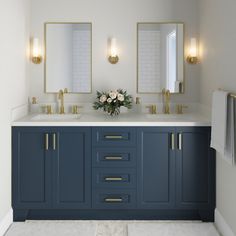 a bathroom with double sinks and two mirrors