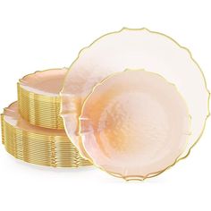 three plates stacked on top of each other in front of a stack of gold coins