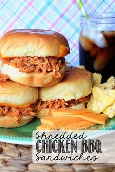 shredded chicken bbq sandwiches are stacked on a plate