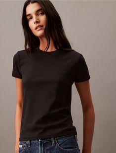 A classic cotton t-shirt, refined in a sleek silhouette. Styled with short sleeves and a crewneck. Made with a soft hand for extra comfort.  Material: 100% Cotton. Soft Hands, Soft Hand, Cotton T Shirt, Cotton Tee, Cotton Tshirt, Calvin Klein, Short Sleeves, Sleek, Crew Neck