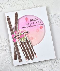 a close up of a greeting card with skis