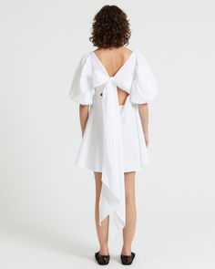 made in Portugal 
Mini dress with puff sleeves  
wide tie straps at back which can be tied as a bow
A-shaped 
the model (1.77m) is wearing size S Aylin Koenig, Dress With Puff Sleeves, Professional Cleaning, Puff Sleeves, Puff Sleeve, White And Black, Cut Out, Portugal, Mini Dress