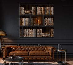 a living room filled with furniture and lots of bookshelves on the wall behind it