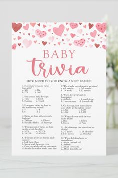 a baby trivia card with hearts on it