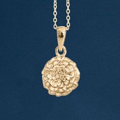 A stunning gold marigold necklace personalised with an optional engraved tag Featuring a beautifully detailed marigold flower charm, this beautiful pendant is crafted from the finest sterling silver and plated with 18ct yellow gold plated making it suitable for almost any age. Marigolds are associated with warmth and joy, making them a perfect gift to celebrate an October birthday or to signify a fresh start. This necklace make a wonderful gift perfect for bridesmaids, besties or just as a treat Yellow Gold Flower Charm Pendant Necklace, Yellow Gold Flower Charm Necklaces, Yellow Gold Flower-shaped Necklaces With Charms, Yellow Gold Flower Necklaces With Charms, Yellow Gold Pendant Charm Necklace With Flower, Yellow Gold Flower-shaped Necklace With Charms, Yellow Gold Necklaces With Birth Flower In Sterling Silver, 14k Gold Flower Charm Necklace With Pendant, Yellow Gold Sterling Silver Necklace With Birth Flower