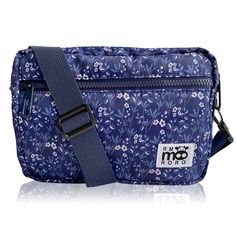 a blue bag with flowers on it and a strap around the bottom, sitting on a white surface