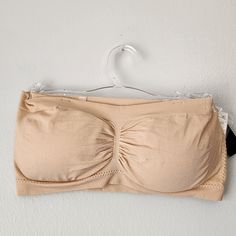 Free Press Beige Almond Bandeau Bra Nwt Beige Almond Size: S/M 92% Nylon 8% Spandex Strapless Nylon Tube Top With Built-in Bra, Spring Stretch Nylon Tube Top, Spring Nylon Stretch Tube Top, Seamless Stretch Tube Top Shapewear, Seamless Stretch Tube Top For Shapewear, Seamless Stretch Shapewear Tube Top, Stretch Bandeau Tube Top With Removable Bra Pads, Stretch Tube Top With Built-in Bra And Full Coverage, Fitted Nylon Strapless Tube Top