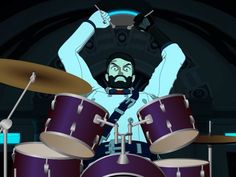 a man with a beard playing the drums