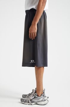 Balenciaga brings its bent for the bold to your casual wardrobe with these dramatically baggy cotton shorts distressed and faded to old-favorite perfection. 13 1/2" inseam; 31 1/2" leg opening; 15 1/2" front rise; 18" back rise (size Medium) Elastic waist 100% cotton Machine wash, dry flat Made in Portugal Designer Clothing Streetwear Bottoms With Built-in Shorts, Mid-thigh Length, Sporty Summer Bottoms With Straight Hem, Sporty Bottoms With Straight Hem For Summer, Sporty Knee-length Bottoms With Relaxed Fit, Sporty Knee-length Relaxed Fit Bottoms, Sport Icon, Casual Wardrobe, Cotton Shorts, Balenciaga