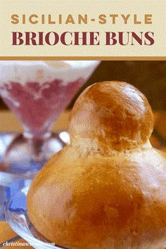 a close up of bread on a plate near a bowl and drink in the background