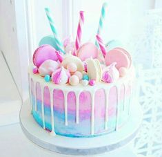 there is a cake decorated with marshmallows and candy