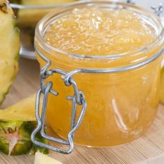 pineapple jam in a glass jar on a cutting board