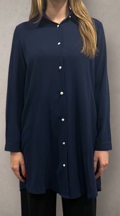 Modest v-neckline with collar. Pearl button down front. Buttoned sleeves. Elegant V-neck Shirt With Back Button Closure, Fall V-neck Blouse With Placket, Fall V-neck Blouse With Buttons, Fall V-neck Shirt With Button Closure, Elegant V-neck Shirt For Daywear, Elegant V-neck Blouse With Back Button Closure, Formal V-neck Shirt With Button Closure, Formal V-neck Shirt With Buttons, V-neck Buttoned Blouse For Fall