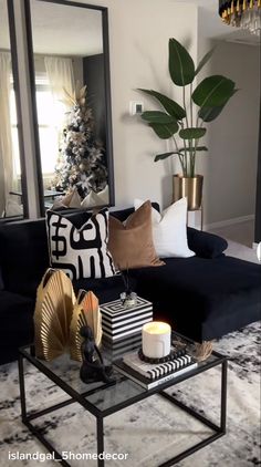 a living room filled with furniture and a large mirror on the wall above it's coffee table