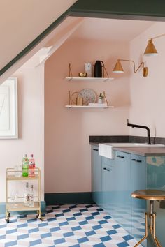 a kitchen with blue and white checkered flooring