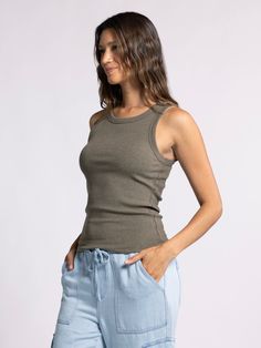 Style Description: Forever timeless in the EDLIN TANK! Crafted in a soft ribbed fabrication, this tank is a wear-everywhere kind of essential. Sleeveless tank Crew neckline Measurements for a size small: Length: 23" Chest: 14" Waist: 13" Fabric Content/Care: 48% Cotton 48% Modal 4% Spandex Machine Wash ColdImport Everyday Ribbed Camisole In Solid Color, Solid Ribbed Camisole For Everyday, Everyday Ribbed Solid Color Camisole, Green Scoop Neck Tank Top For Loungewear, Ribbed Tank Top For Everyday Spring Wear, Green Scoop Neck Tank Top For Everyday, Ribbed Tank Top For Everyday Wear, Casual Ribbed Cotton Camisole, Everyday Green Scoop Neck Tank Top