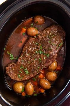 the meat and potatoes are being cooked in the slow - cooker for this meal