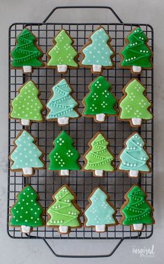 decorated christmas cookies on a cooling rack