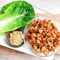 lettuce, meat and other foods are on a plate next to each other