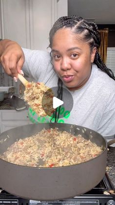 a woman stirring food in a pan on the stove